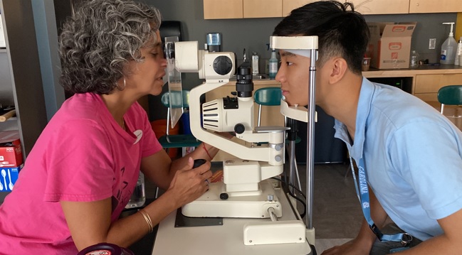 Photo of eyes being examined at an In Her Vision event