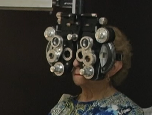 Universite de Montreal. Ecole d'optometrie Photo of elderly woman receiving an eye exam