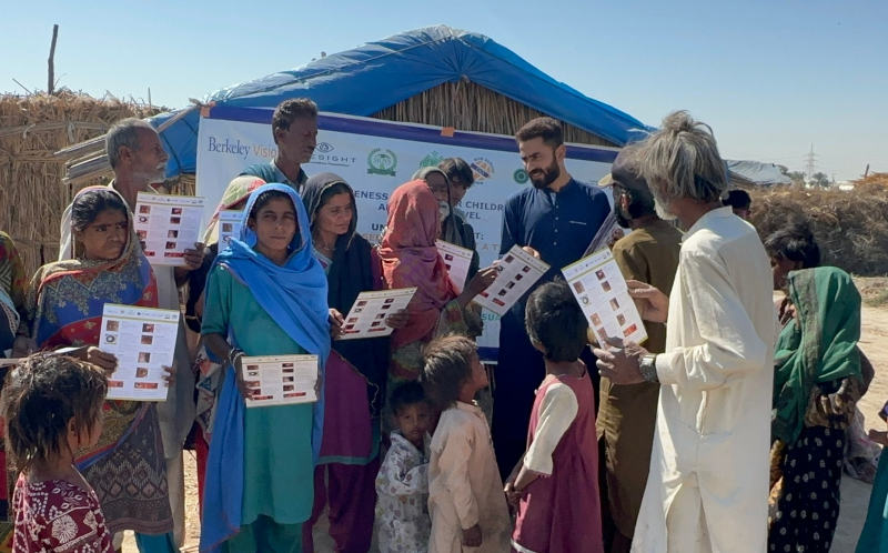 A photo with parents and children in Pakistan learning about the importance of eye care.